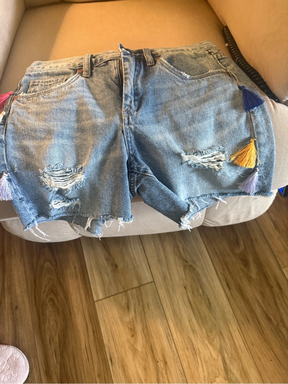 Blank NYC Light Blue Distressed Denim Shorts with Multicolor Tassels